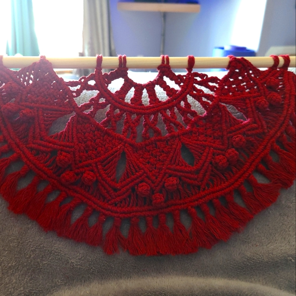 Red macrame wall hanging